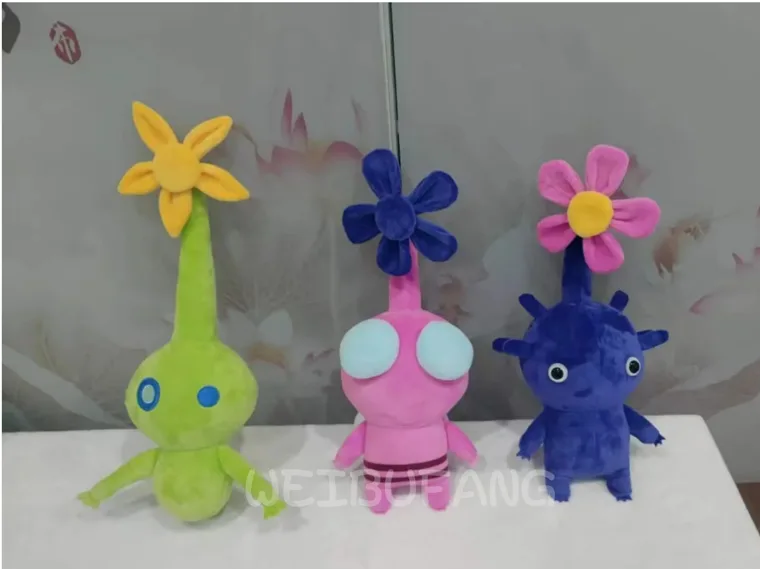 Green, pink and blue characters with long flower stems and colourful petals.