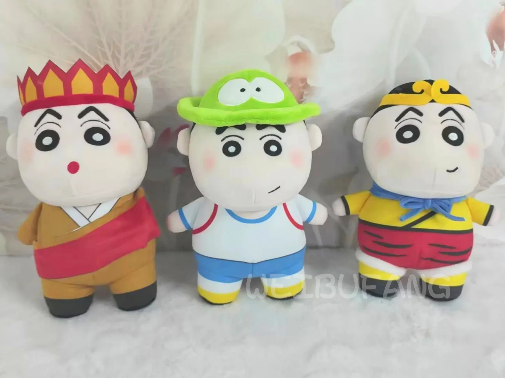 Three coordinated fabric figures in colourful character costumes.